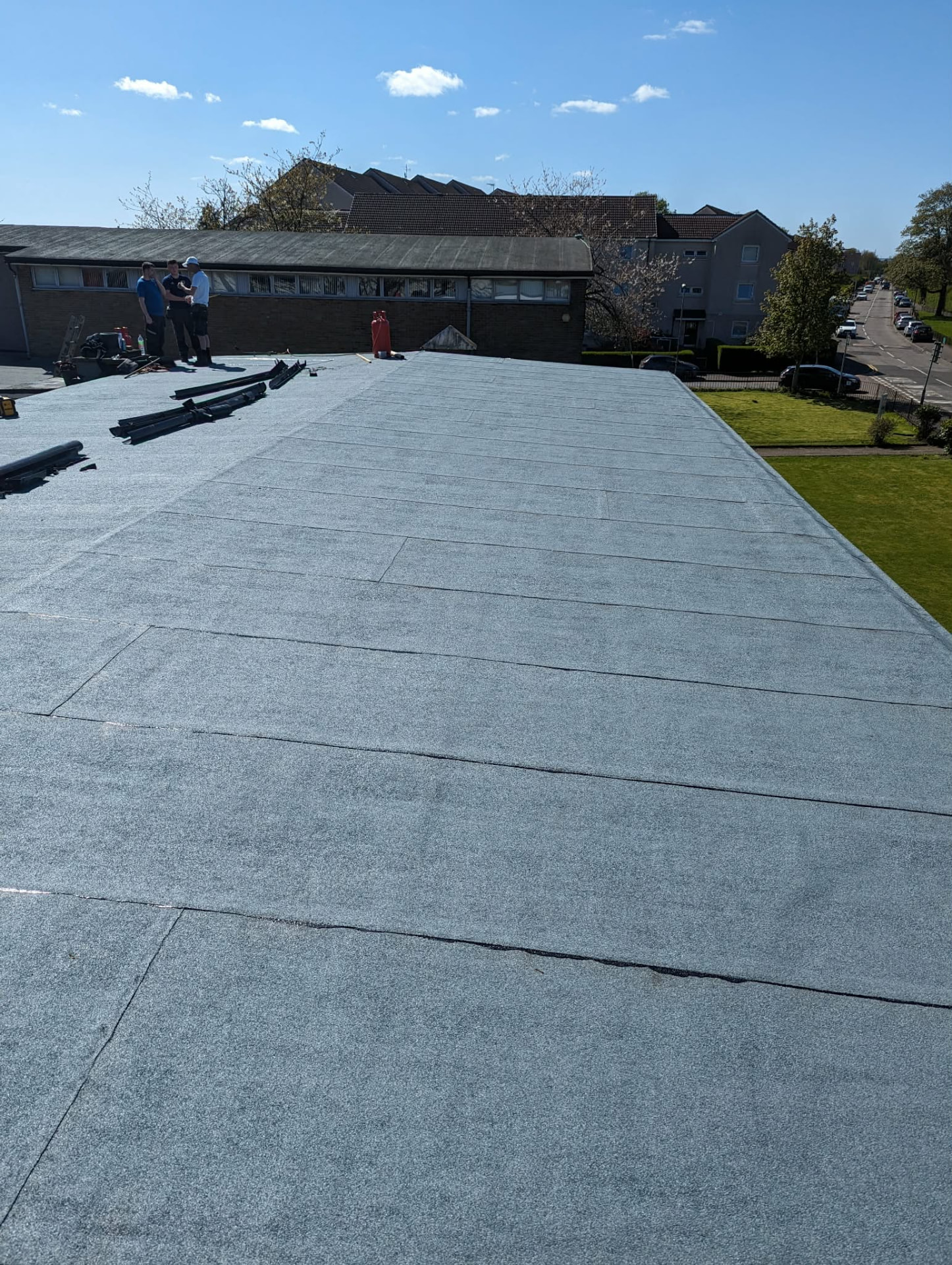 Scotsway Roofing team installing a large flat roof