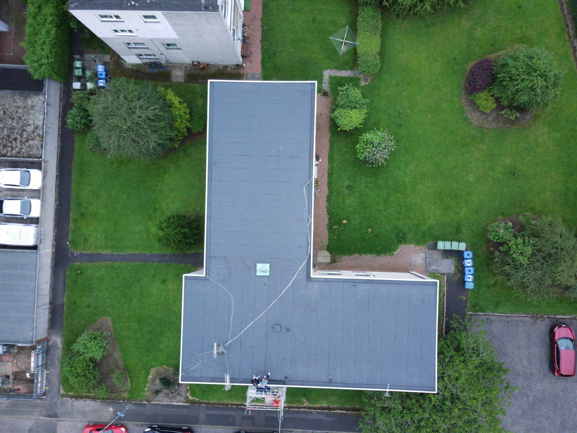 Aerial shot of a newly covered flat roof and surrounding gardens