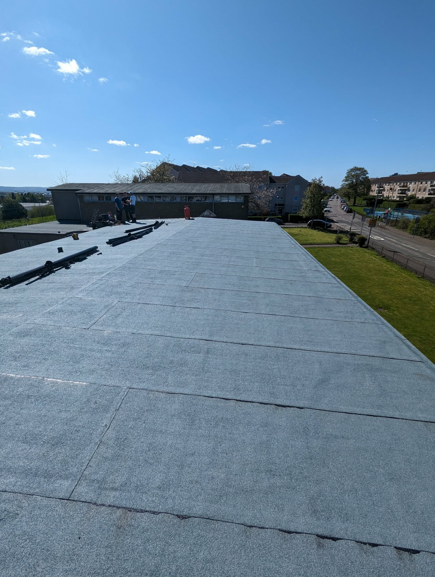 Completed torch-on felt flat roof overlooking Glasgow