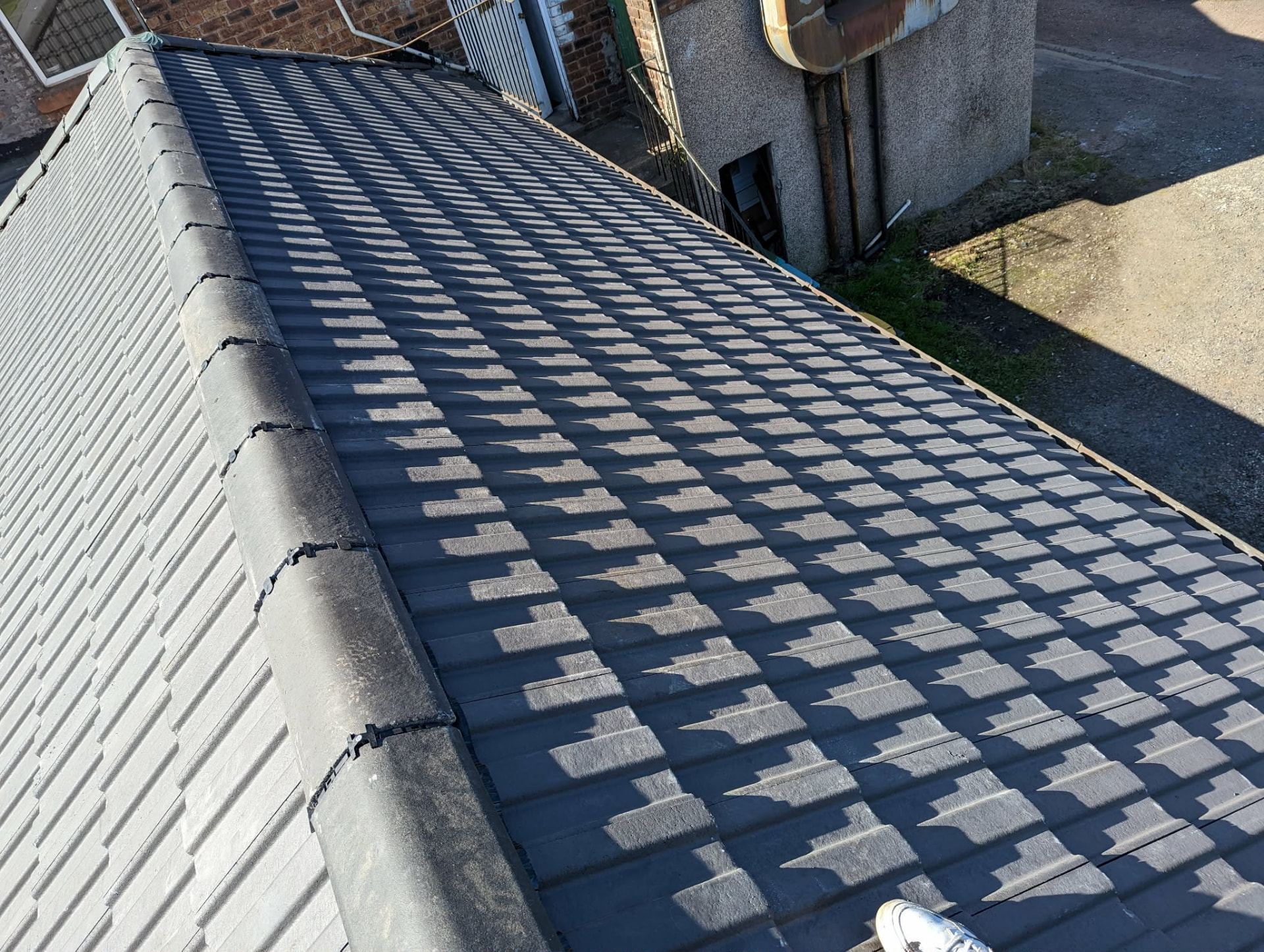 Interlocking tile roof finished with mortared ridge